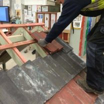 Apprentice Harry working on roof tiling at college