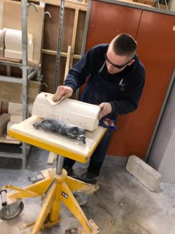 Image showing Sam polishing his stone in the final stages of his project
