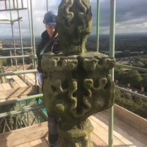 Site foreman assesing the damage to the stonework on the pinnacle