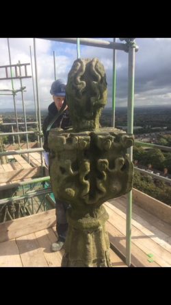 Site foreman assesing the damage to the stonework on the pinnacle