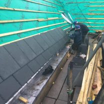 Image showing new slates being laid to the roof of the chapel