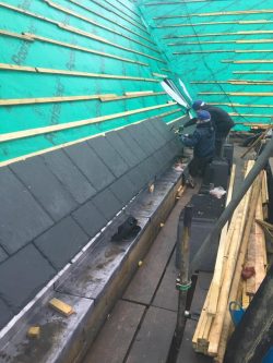 Image showing new slates being laid to the roof of the chapel
