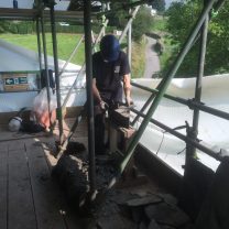 Image of Heritage roofers cutting slate to size