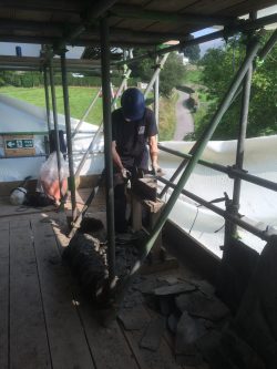 Image of Heritage roofers cutting slate to size