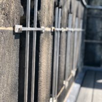 Image of the new stainless steel safety grills installed to the Parapet openings to the top of the Tower