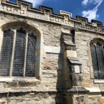 Image of newly carved stone Parapets and Battlement stones installed alongside the existing stones along with the completed works across the South Aisle