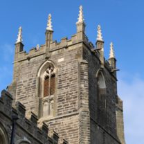 Image showing the new Pinnacles standing tall, along with new masonry to the Belfry Windows on the Tower