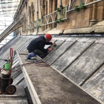 Image showing one of our Lead workers welding the new vents into position