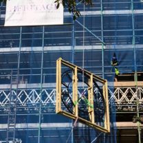 Image showing the new Clock Faces being hoisted up the scaffold