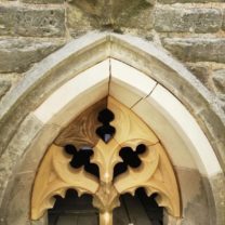 Image of the newly carved and installed Tracery window along with new voissours fitted into place