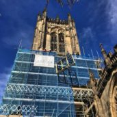 Image of the clock being lifted up the Tower Manchester Cathedral