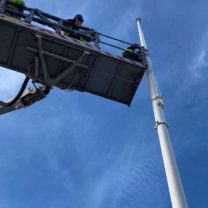 Image showing a Cherry Picker being used to carry out the installation of the new flag pole at the top of the Tower