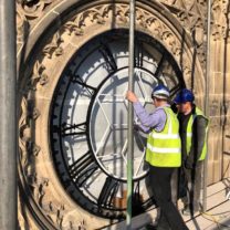 Image showing Architect Mark Pearce inspecting the new Clock Faces