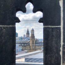 Image showing a View of the Town Hall through one of the Parapet openings on the Tower roof