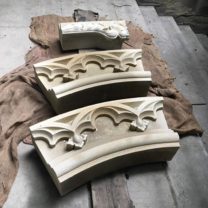 Image showing Newly carved sections of the clock surround ready to go to site