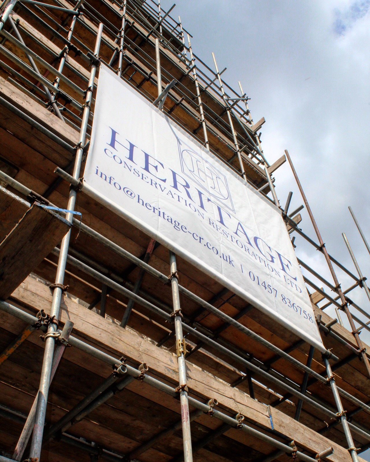 Heritage signage on the scaffold up the Spire at Christ Church