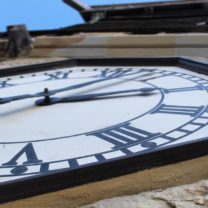 Image showing the restored clock face secured with new surrounds and fixings